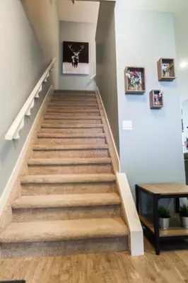 a staircase in a home with wooden floors at 5BDRM Bright Modern Home-King Bed-Garage-Sleeps 12 in Edmonton