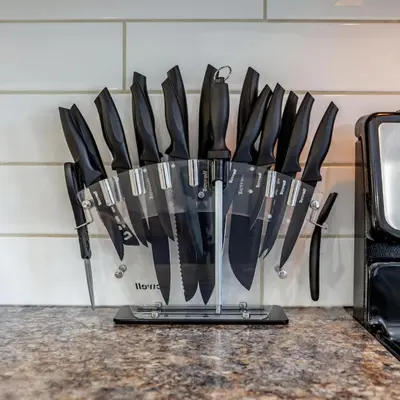 a bunch of knives hanging on a wall at BoHo House-Sleeps 17-Garage-3 Kitchens-Fireplace in Edmonton
