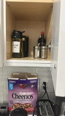 a kitchen shelf with some food and a box of oreos at Metrotown area in Vancouver