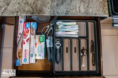 a drawer with scissors and other items on a counter at Spacious 6BDR Oasis - Sleeps 17 - Garage - Fireplace in Edmonton