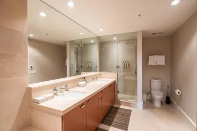 a bathroom with a sink and a shower and a toilet at Fitzsimmons Walk 15 by Outpost Whistler in Whistler