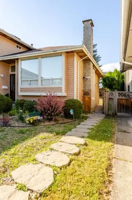 a house with a pathway in front of it at Spacious & Cozy 1 Bedroom Suite in North Vancouver in North Vancouver