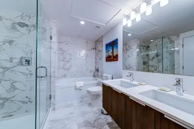 a bathroom with a sink and a toilet and a shower at Corporate Stays Tate 1 Bedroom in Vancouver
