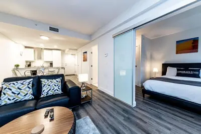 a living room with a bed and a couch at Corporate Stays Tate 1 Bedroom in Vancouver