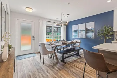 a dining room with a table and chairs at Classic Modern 4BR Nearby DT Hot tub and Pool in Canmore