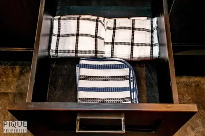 two towels in a wooden box with a drawer at Bright Modern Suites-King Beds-NFLX-WiFi-LongStays in Edmonton