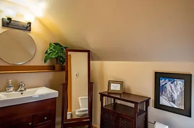 a bathroom with a sink and a mirror at Timberloft by Revelstoke Vacations in Revelstoke