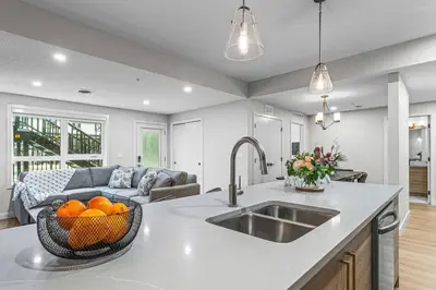 a kitchen with a sink and a bowl of oranges at Spacious 3BR Haven in Scenic Canmore in Canmore