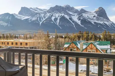 a view of a snow covered mountain from a balcony at 3BR with Stunning Views Self Check-In and Free Parking in Canmore