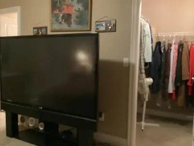 a flat screen tv sitting in a closet at Barry and Elaine in Abbotsford
