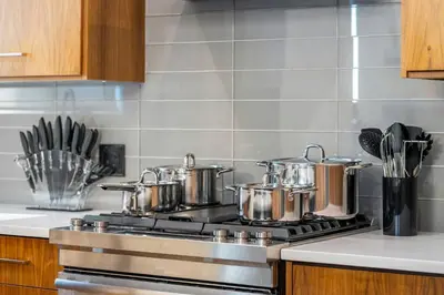 a kitchen stove with pots and pans on it at *Incredible Location* |Two King Beds| Free Parking in Calgary