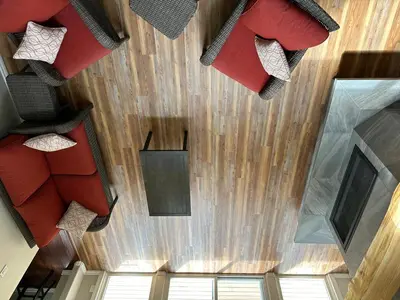 an overhead view of a room with red furniture at Charming 4-Bedroom Home in Bella Coola in Hagensborg