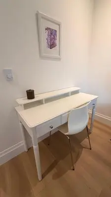 a white desk with a chair and a picture on a wall at Brand-New Luxury Dunbar 4BR Home - Near UBC - Sleep 10 - Ideal for Family in Vancouver