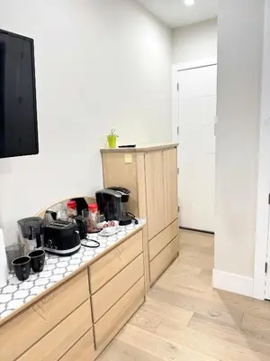 a kitchen with a counter with pots and pans on it at Excellent Place to Stay in Coquitlam