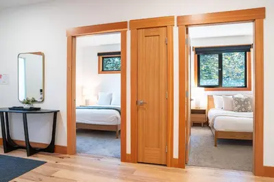 a room with a door leading to a bedroom at Cartier Chalet in Revelstoke
