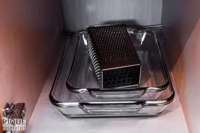 a black object sitting on top of a glass shelf at 6BDRM Chic Modern Home-Fireplace-BBQ-Sleeps 18! in Edmonton