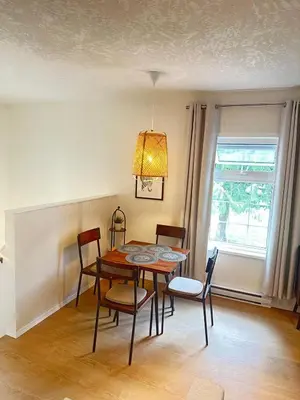 a dining room with a table and chairs and a window at Lake Trail Guesthouse in Victoria