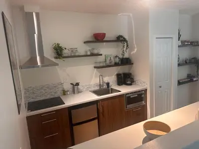 a kitchen with a sink and a counter top at Lake Trail Guesthouse in Victoria