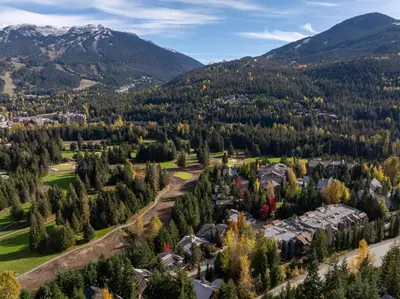 an aerial view of a village in the mountains at 2BR in Ironwood, Stunning Mountain Views, Shared Hot Tub and Pool, Fireplace, Parking in Whistler