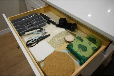 a drawer with a table with scissors and other items at Spacious 3 BDR Suite Sleeps 6 Comfortably in Edmonton