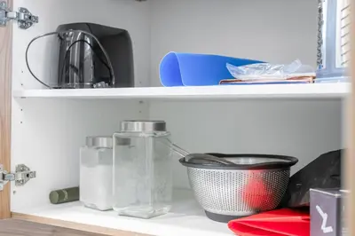 a shelf with glass bottles and a bowl on it at WEM Retreat | 3BR | Mins from the Mall in Edmonton