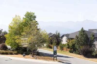 a street sign in a residential neighborhood with houses at Spacious 6BR Home with Terrace Views and Parking nearby parks golf and resorts in Chilliwack