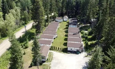 an aerial view of a group of houses in a forest at Mountain View Cabins in Golden