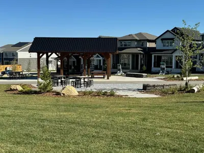 a gazebo with tables and chairs in a park at Rockies Golden Retreat 2BR Suite at Glacier Ridge NW Calgary in Calgary