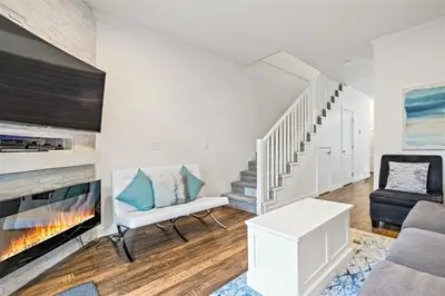 a living room with a couch and a chair at Marvellous Poolside Chalet - Pool & Hot Tub - Pets in Canmore