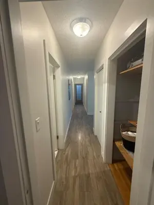 a hallway leading to a room with a hallway at The Sunshine Haven in Delta