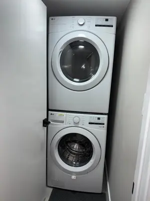 a washer and dryer in a small room at NorthEdge Suites in Edmonton