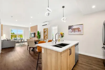 a kitchen and living room with a sink and a counter at New 2BR in DT Golden with AC, Balcony, BBQ, Sleeps 6 in Golden