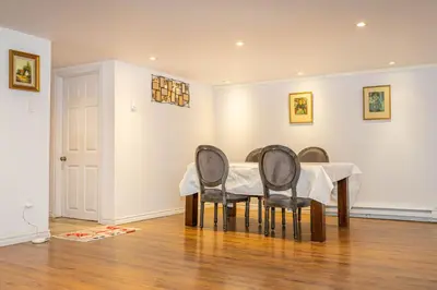 a dining room with a table and four chairs at 2 BDRS at DT-Near 2 metros, Atwater Market, Concordia in Bélanger