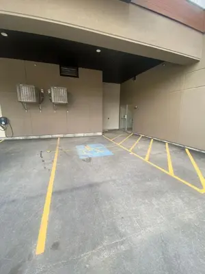 an empty parking lot in a parking garage at Stylish 2BR Golden Getaway with BBQ and Stunning Views in Golden