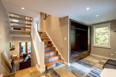 a home with a staircase and a living room at Crystal Ridge by Whistler Retreats in Whistler