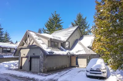 a house with a car parked in the snow at Crystal Ridge by Whistler Retreats in Whistler