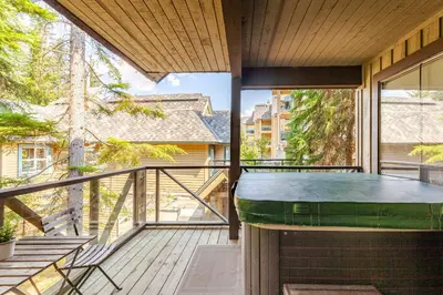 a balcony with a hot tub on a house at Crystal Ridge by Whistler Retreats in Whistler