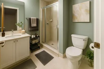 a bathroom with a toilet sink and a shower at Luxury 2-Bedroom Apartment in Coal Harbour with Stunning City Views in Vancouver