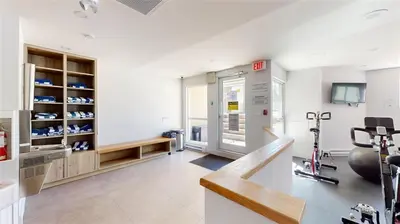a fitness room with a gym with a treadmill at Le Chamois 307 by Outpost Whistler in Whistler