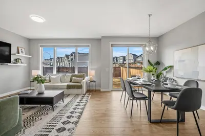 a living room with a table and a couch at The Herron Rise Retreat in Calgary