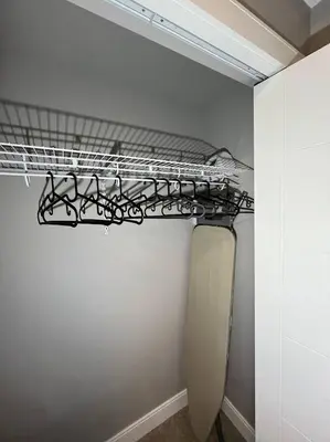 a closet with a shelf and a toilet in a room at Cozy 2BR Retreat | Edmonton SW | Smart TV + Wi-Fi in Edmonton