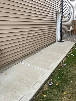 a driveway leading to a house with a door at Cozy 2BR Retreat | Edmonton SW | Smart TV + Wi-Fi in Edmonton