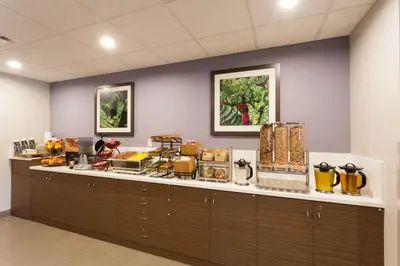 a buffet line with food on top of it at Microtel Inn and Suites by Wyndham Kitimat in Kitimat
