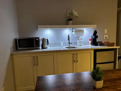 a kitchen with a counter with a microwave on it at Nature Home Near Downtown and 17th Avenue in Calgary