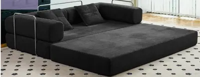 a black couch sitting in a living room at Modern 1BR Suite Sleeps 3-4 in Near YYC Calgary Airport in Calgary