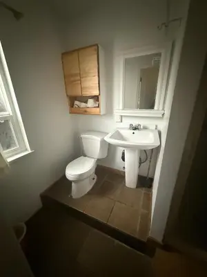a bathroom with a toilet and a sink at EXTRA Large Suite with Ensuite Bathroom, Microwave & Fridge in Richmond