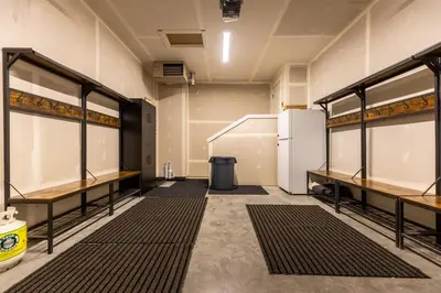 an empty room with shelves and a refrigerator at Four Bears Chalet by Fernie Central Reservations in Fernie