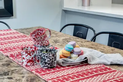 a table with a red and white patterned table cloth at Stunning 3BR Escape with Mountain Views in Canmore in Canmore