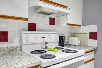 a white stove top oven in a kitchen at Spacious 2BR unit near DT Canmore and Banff in Canmore
