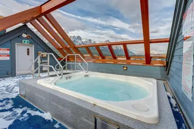 a hot tub on the deck of a cruise ship at 3BR Luxury Top Floor Condo with Great views in Canmore